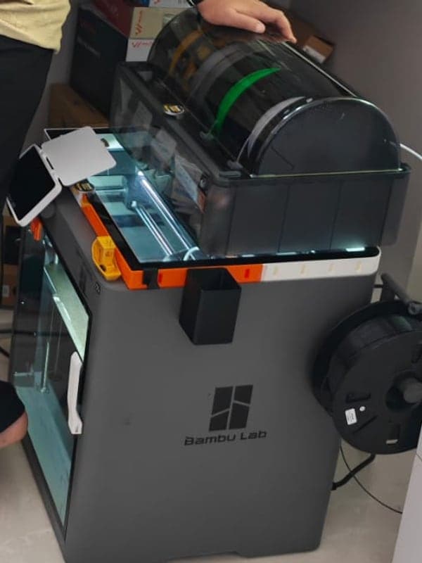 A multi-colour printer loaded with filament spools