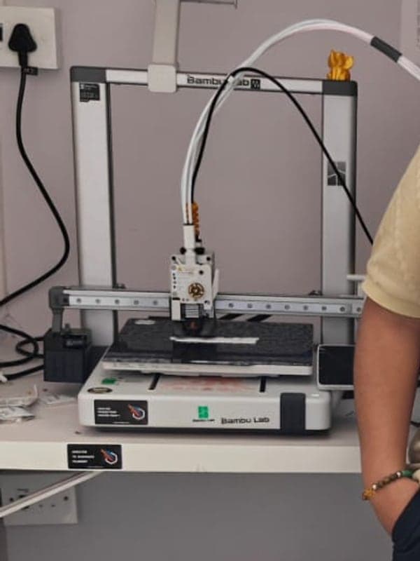 A 3D printer mid-job in the Fidgetoz workshop